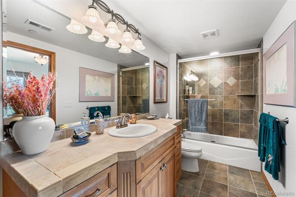 Bathroom, Dual Sink Vanities, Glass Shower, Interior, Recessed Lighting, Tile Countertops