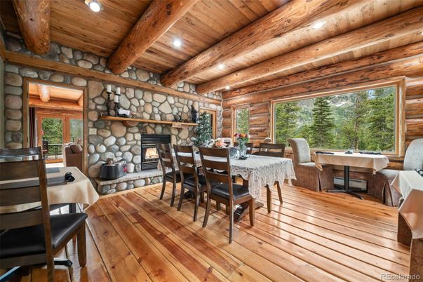 Dining room, Fireplace, Interior, Recessed Lighting, Stone Walls, Wooden Beams, Wooden Ceilings, Wood Texture Flooring