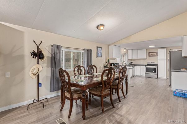 Dining room, Interior, Kitchen, Recessed Lighting, Stainless Steel Appliances, Wood Texture Flooring