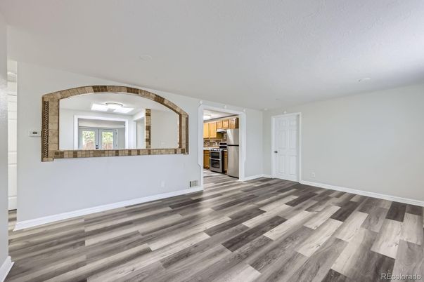 Empty room, Interior, Kitchen, Stainless Steel Appliances, Wood Texture Flooring