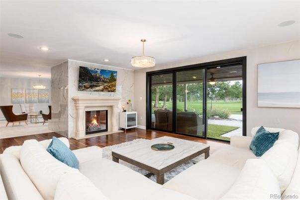 Chandelier, Dining room, Fireplace, Interior, Living room, Pendant Lights, Recessed Lighting, Wood Texture Flooring