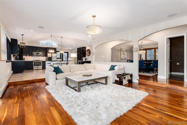 Chandelier, Dining room, Interior, Kitchen, Living room, Pendant Lights, Recessed Lighting, Stainless Steel Appliances, Wood Texture Flooring