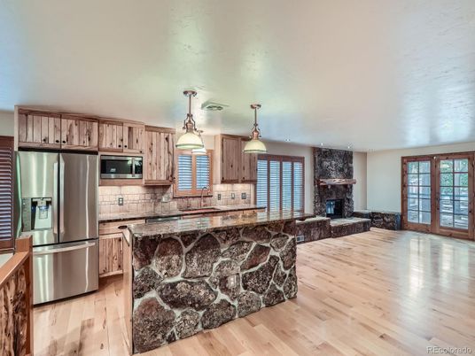 Fireplace, Interior, Kitchen, Pendant Lights, Stainless Steel Appliances, Wood Texture Flooring