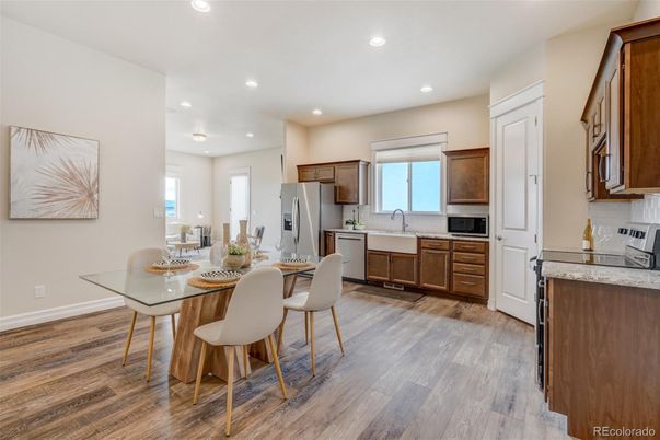Dining room, Interior, Kitchen, Recessed Lighting, Stainless Steel Appliances, Wood Texture Flooring