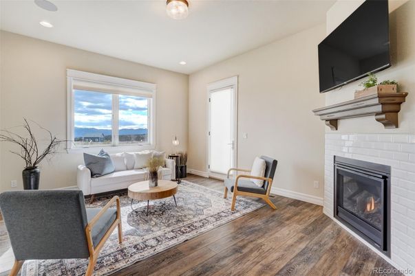 Fireplace, Interior, Living room, Recessed Lighting, Water, Wood Texture Flooring