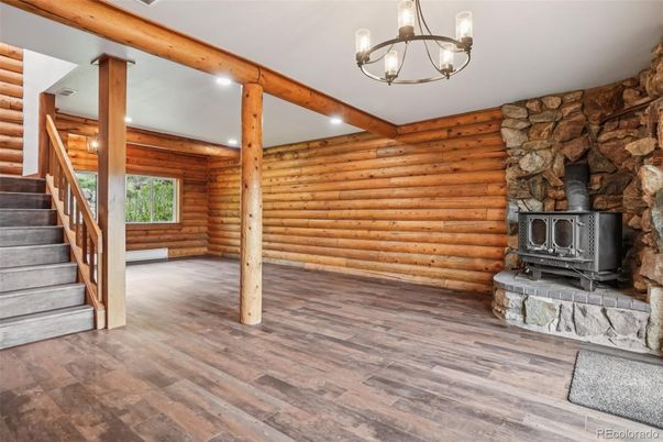 Empty room, Fireplace, Interior, Pendant Lights, Recessed Lighting, Stone Walls, Wooden Beams, Wood Texture Flooring, Wooden Walls