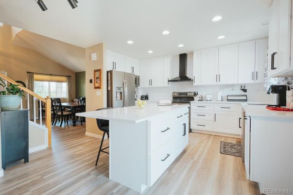 Dining room, Interior, Kitchen, Recessed Lighting, Stainless Steel Appliances, Wood Texture Flooring