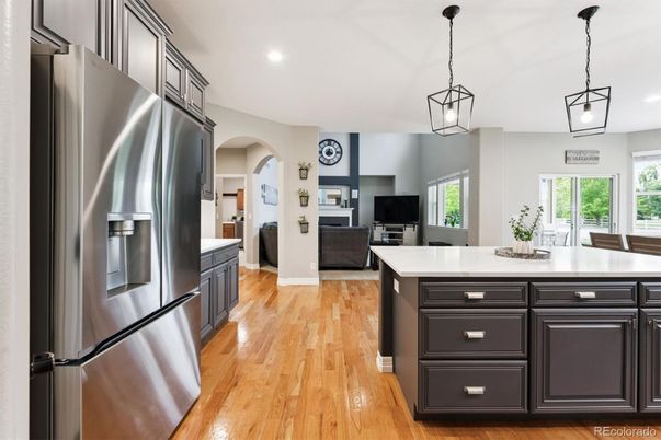 Fireplace, Interior, Kitchen, Living room, Pendant Lights, Recessed Lighting, Stainless Steel Appliances, Wood Texture Flooring