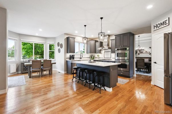 Dining room, Interior, Kitchen, Pendant Lights, Recessed Lighting, Stainless Steel Appliances, Wood Texture Flooring