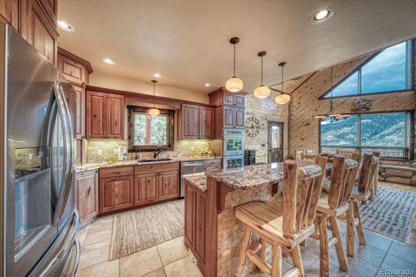 Interior, Kitchen, Pendant Lights, Recessed Lighting, Stainless Steel Appliances, Stone Walls