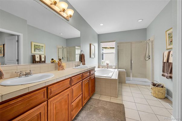 Bathroom, Dual Sink Vanities, Glass Shower, Interior, Recessed Lighting, Tile Countertops