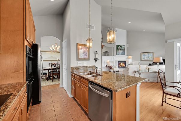 Chandelier, Dining room, Fireplace, Interior, Kitchen, Living room, Pendant Lights, Recessed Lighting, Wood Texture Flooring