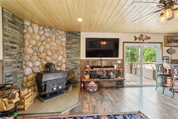 Fireplace, Interior, Recessed Lighting, Stone Walls, Wood Texture Flooring