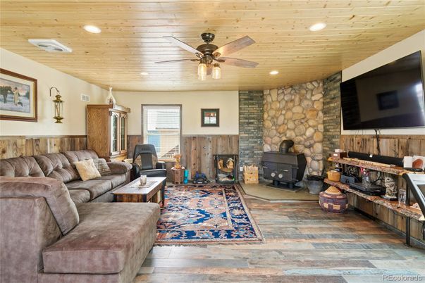 Fireplace, Interior, Living room, Recessed Lighting, Stone Walls, Wooden Ceilings, Wood Texture Flooring