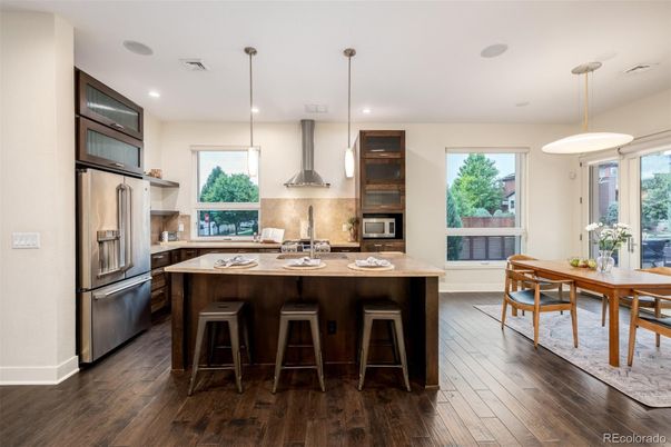 Dining room, Interior, Kitchen, Pendant Lights, Recessed Lighting, Stainless Steel Appliances, Wood Texture Flooring