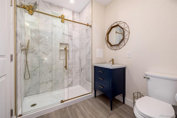 Bathroom, Glass Shower, Interior, Marble Walls, Recessed Lighting, Wood Texture Flooring