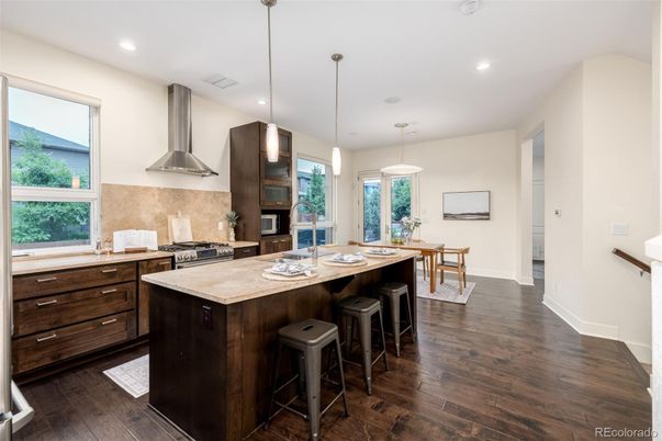 Dining room, Interior, Kitchen, Pendant Lights, Recessed Lighting, Stainless Steel Appliances, Wood Texture Flooring