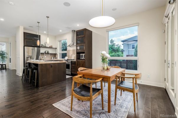 Dining room, Interior, Kitchen, Pendant Lights, Recessed Lighting, Stainless Steel Appliances, Wood Texture Flooring