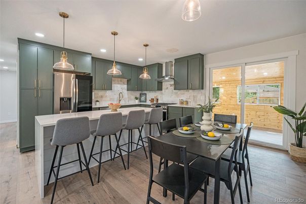 Dining room, Interior, Kitchen, Pendant Lights, Recessed Lighting, Stainless Steel Appliances, Wood Texture Flooring