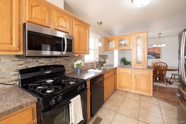 Dining room, Interior, Kitchen, Pendant Lights, Stainless Steel Appliances, Wood Texture Flooring