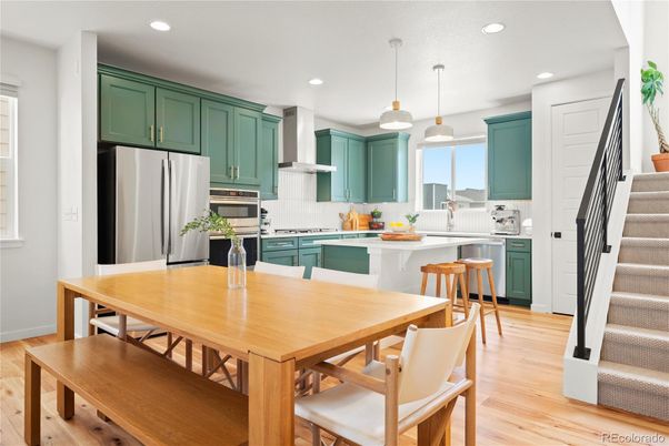 Dining room, Interior, Kitchen, Pendant Lights, Recessed Lighting, Stainless Steel Appliances, Wood Texture Flooring