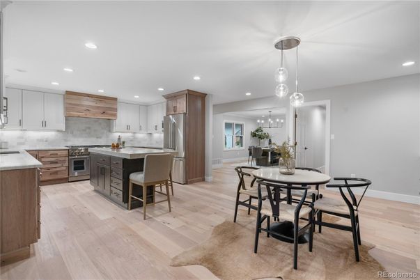Dining room, Interior, Kitchen, Pendant Lights, Recessed Lighting, Stainless Steel Appliances, Wood Texture Flooring