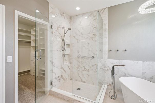 Bathroom, Free Standing Baths, Glass Shower, Interior, Marble Walls, Recessed Lighting, Walk-in Closets