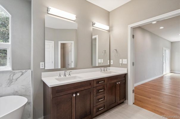 Bathroom, Dual Sink Vanities, Free Standing Baths, Interior, Marble Walls, Recessed Lighting, Wood Texture Flooring