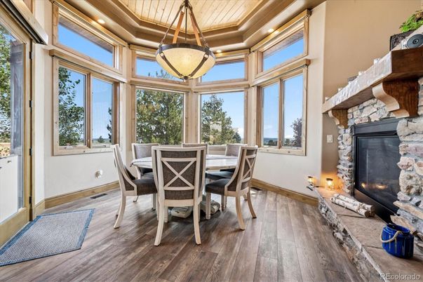 Dining room, Fireplace, Interior, Pendant Lights, Recessed Lighting, Sun Room, Wood Texture Flooring