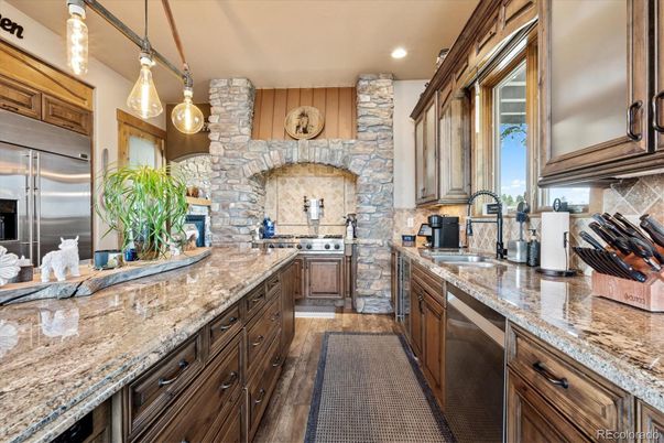 Interior, Kitchen, Pendant Lights, Recessed Lighting, Stainless Steel Appliances, Stone Walls, Wood Texture Flooring