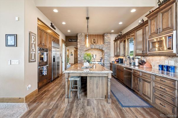 Interior, Kitchen, Pendant Lights, Recessed Lighting, Stainless Steel Appliances, Stone Walls, Wood Texture Flooring