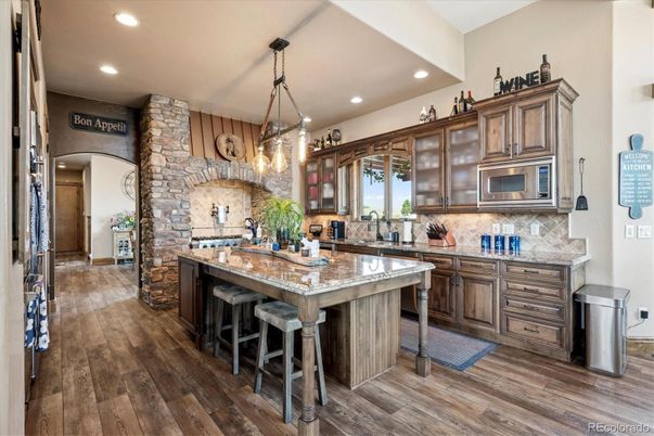 Interior, Kitchen, Pendant Lights, Recessed Lighting, Stainless Steel Appliances, Stone Walls, Wood Texture Flooring