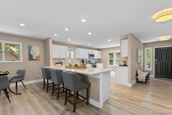 Dining room, Interior, Kitchen, Recessed Lighting, Stainless Steel Appliances, Wood Texture Flooring