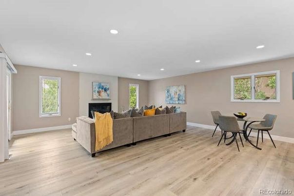 Dining room, Fireplace, Interior, Living room, Recessed Lighting, Wood Texture Flooring