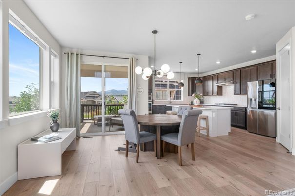 Dining room, Interior, Kitchen, Pendant Lights, Recessed Lighting, Stainless Steel Appliances, Wood Texture Flooring