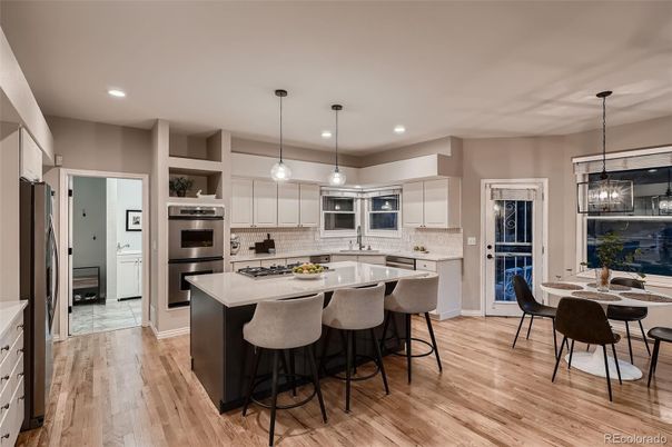 Dining room, Interior, Kitchen, Pendant Lights, Recessed Lighting, Stainless Steel Appliances, Wood Texture Flooring