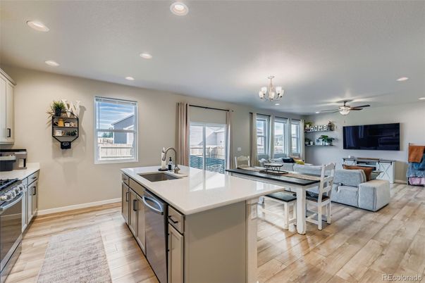 Chandelier, Dining room, Interior, Kitchen, Living room, Recessed Lighting, Stainless Steel Appliances, Wood Texture Flooring