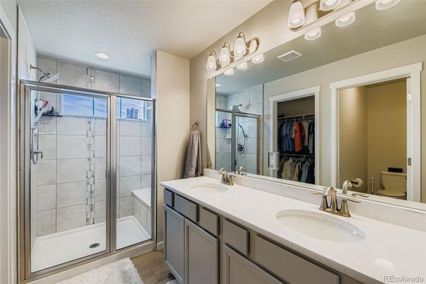 Bathroom, Dual Sink Vanities, Glass Shower, Interior, Recessed Lighting, Wood Texture Flooring