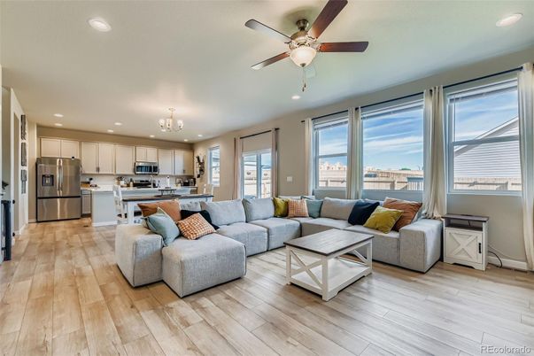 Chandelier, Interior, Kitchen, Living room, Recessed Lighting, Stainless Steel Appliances, Wood Texture Flooring