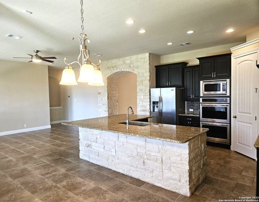 Interior, Kitchen, Pendant Lights, Recessed Lighting, Stainless Steel Appliances, Stone Walls