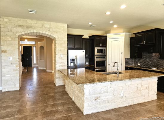 Interior, Kitchen, Recessed Lighting, Stainless Steel Appliances, Stone Walls