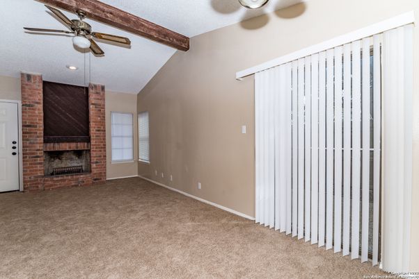Empty room, Fireplace, Interior, Recessed Lighting, Stone Walls, Wooden Beams