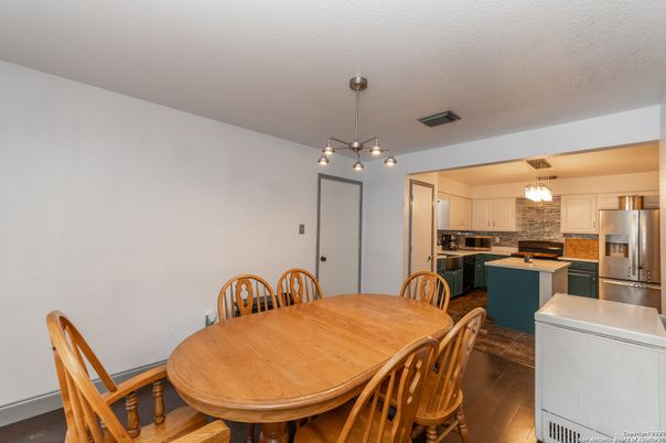 Dining room, Interior, Kitchen, Pendant Lights, Stainless Steel Appliances, Wood Texture Flooring