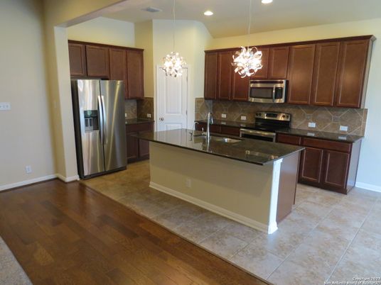 Chandelier, Interior, Kitchen, Pendant Lights, Recessed Lighting, Stainless Steel Appliances, Wood Texture Flooring