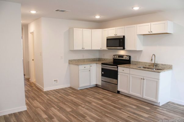 Interior, Kitchen, Recessed Lighting, Stainless Steel Appliances, Wood Texture Flooring