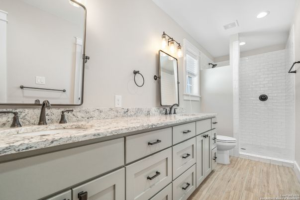 Bathroom, Dual Sink Vanities, Interior, Recessed Lighting, Wood Texture Flooring