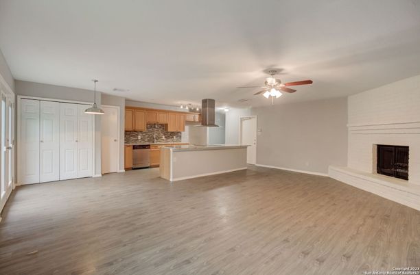Empty room, Fireplace, Interior, Kitchen, Pendant Lights, Wood Texture Flooring