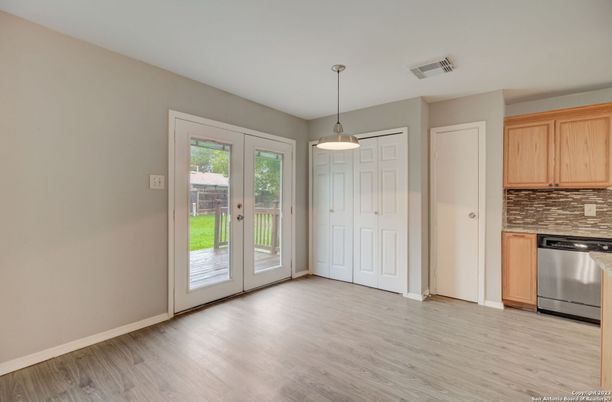 Empty room, Interior, Kitchen, Pendant Lights, Stainless Steel Appliances, Wood Texture Flooring