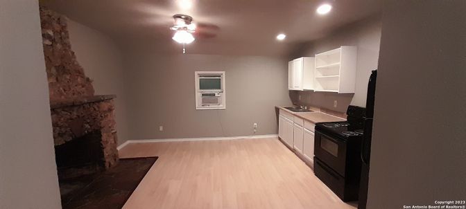Fireplace, Interior, Kitchen, Recessed Lighting, Wood Texture Flooring