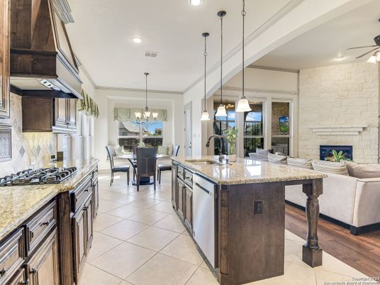 Chandelier, Dining room, Fireplace, Interior, Kitchen, Pendant Lights, Recessed Lighting, Stainless Steel Appliances, Stone Walls